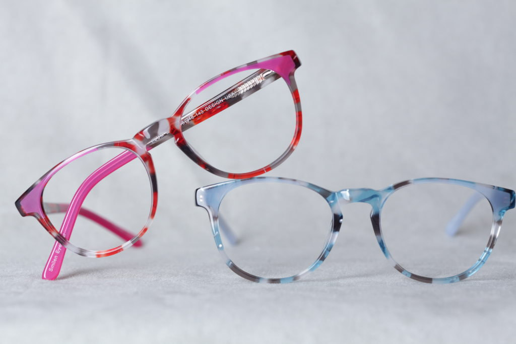 Pink and red and blue grey plastic eyeglass frames